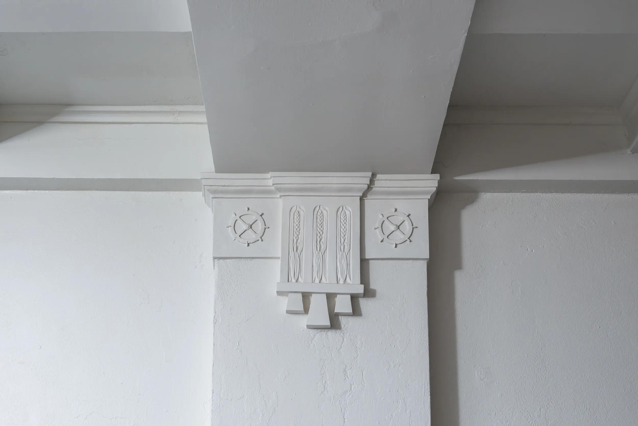 Architectural detail of Globe Mills insignia. Photo: Joshua Targownik / targophoto.com 